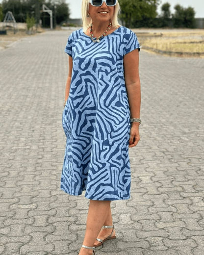 Nelia™ - Summer dress with a round neck and a beautiful print